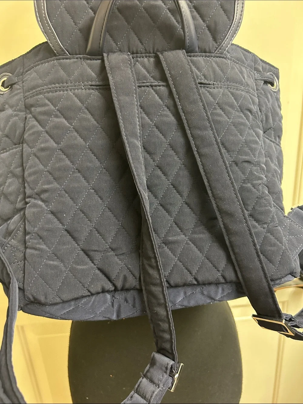 Vera Bradley quilted backpack in navy blue, diamond pattern a front flap closure